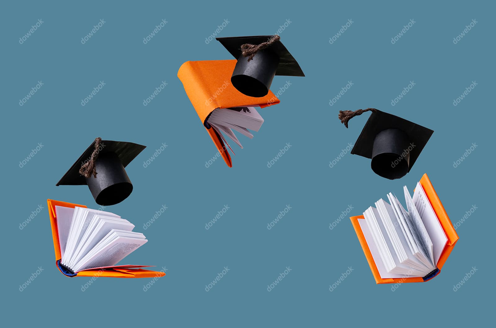 飘在空中的书本和学士帽高清图片素材(JPG)
