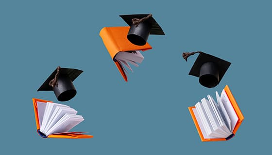 飘在空中的书本和学士帽高清图片素材(JPG)